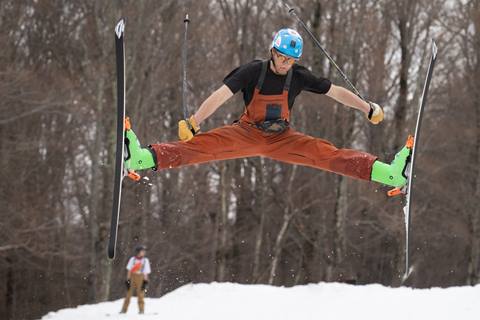 Skier jumping in spring conditions