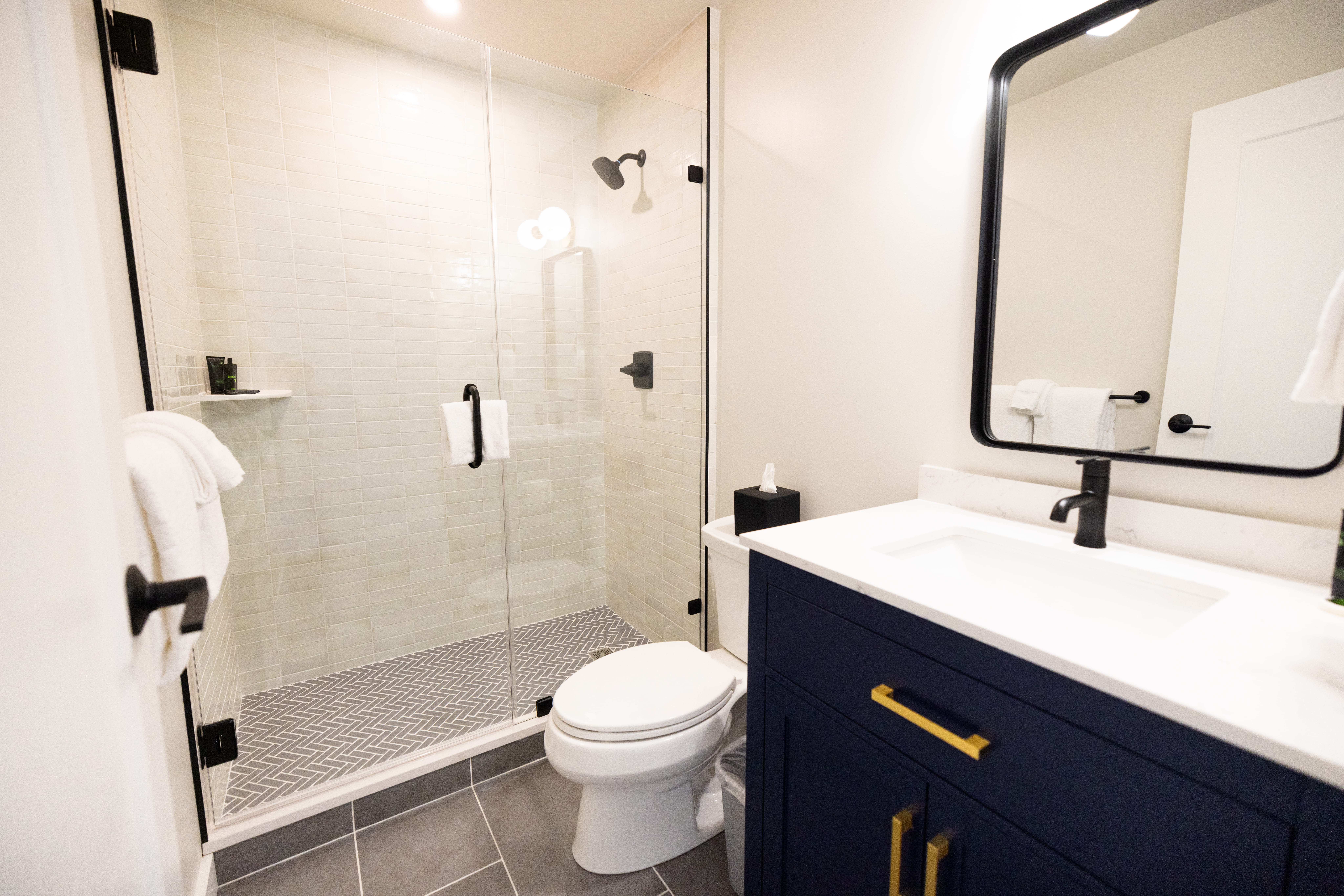 renovated bathroom with glass shower and modern finishes