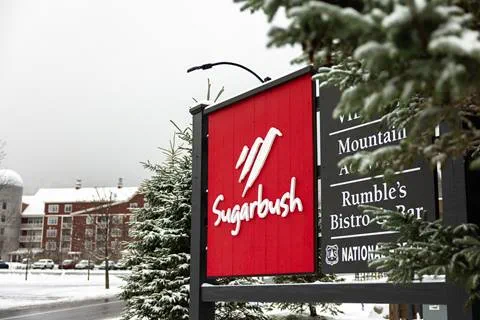 sugarbush welcome sign with snow and trees