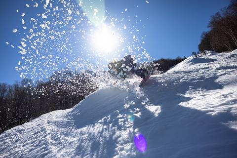 Snowboarder on a sunny spring day