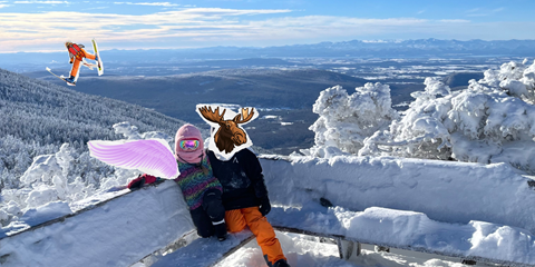 Mountaintop scenic photo of two people with stickers