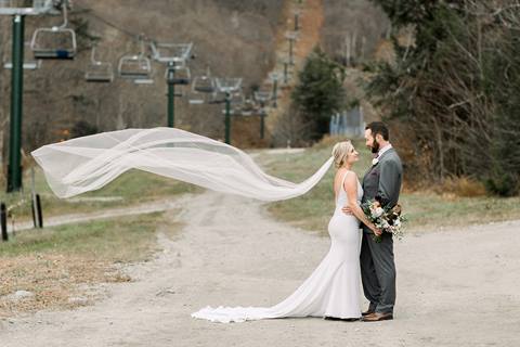 Formal Bride and Groom Portrait in front of chairlift