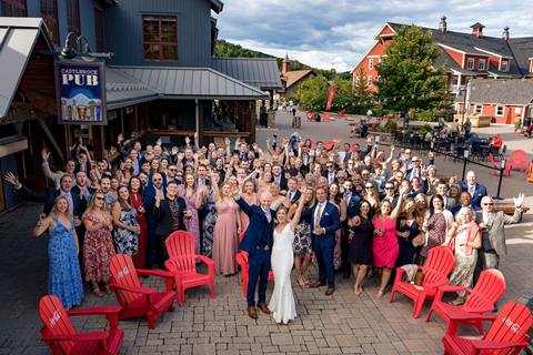 Bride and Groom pose with wedding guests in Lincoln Peak Courtyard