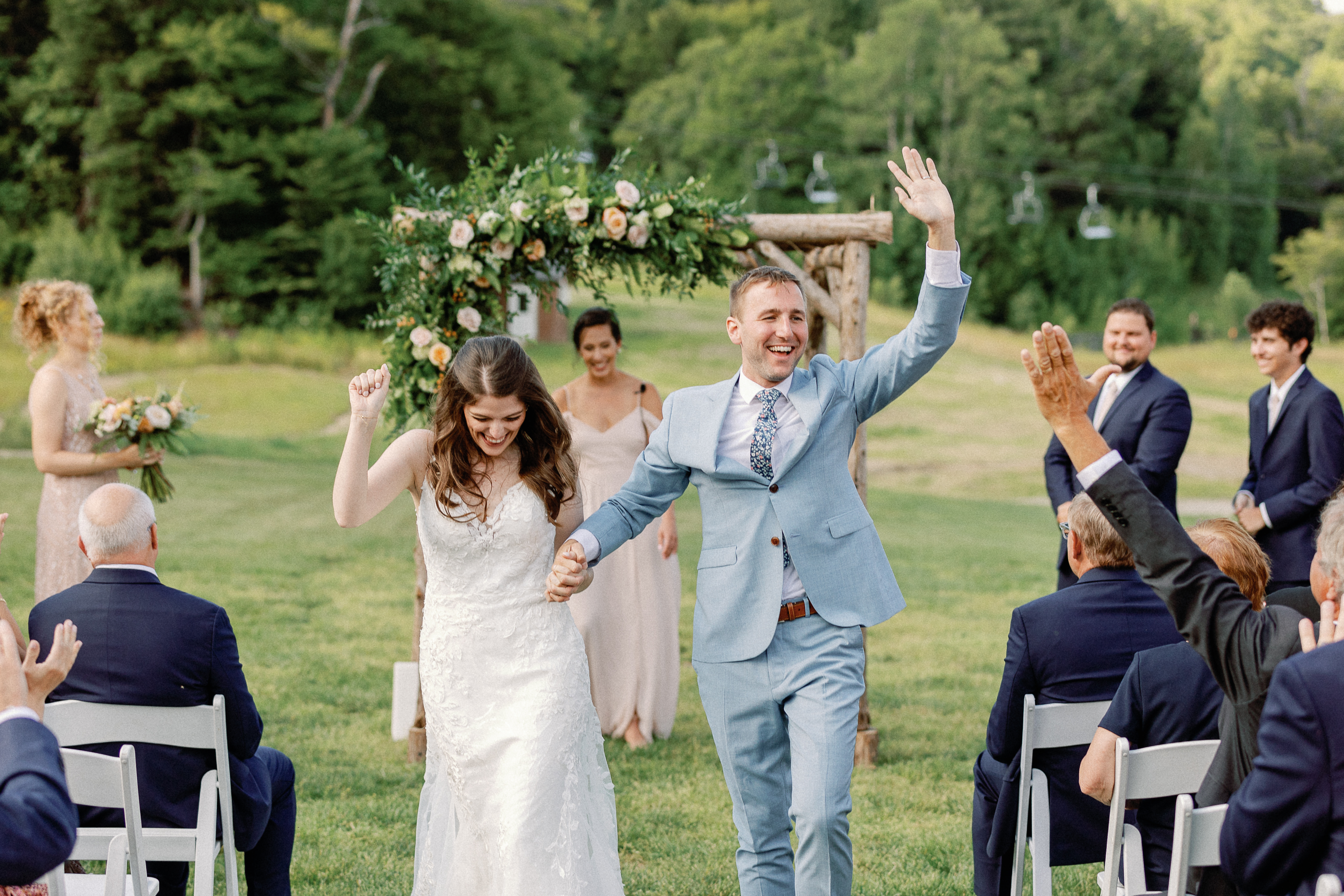 Bride and Groom walk down the aisle after being married