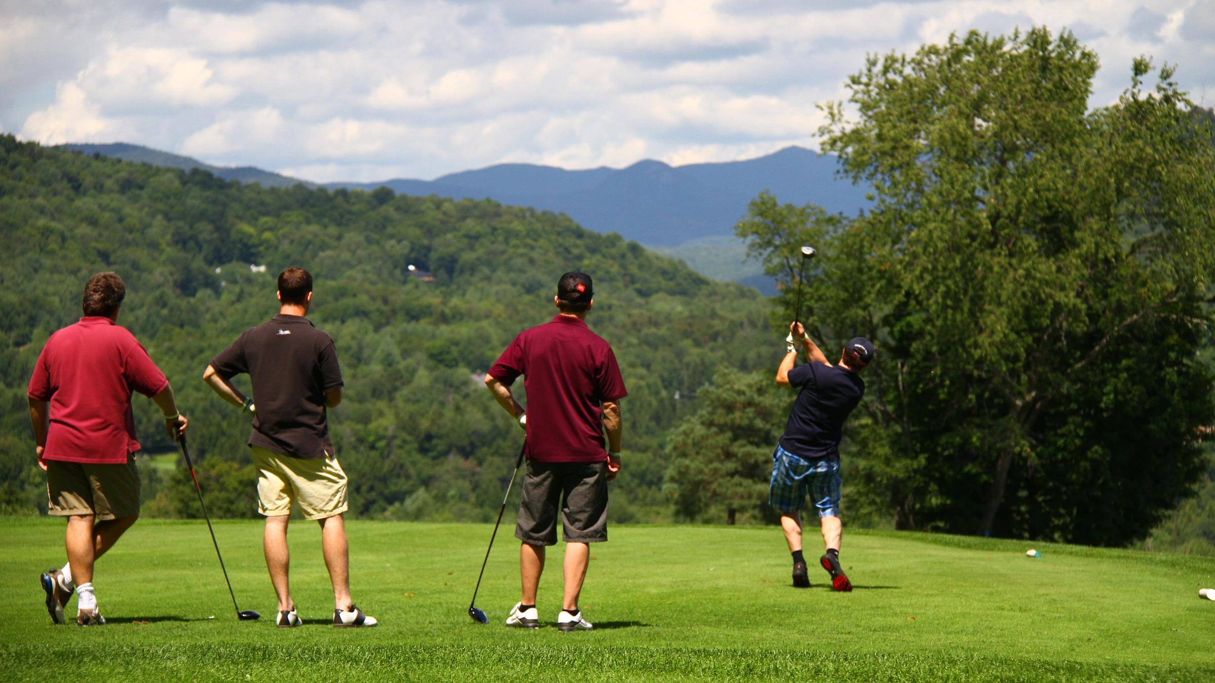 Group of friends teeing off