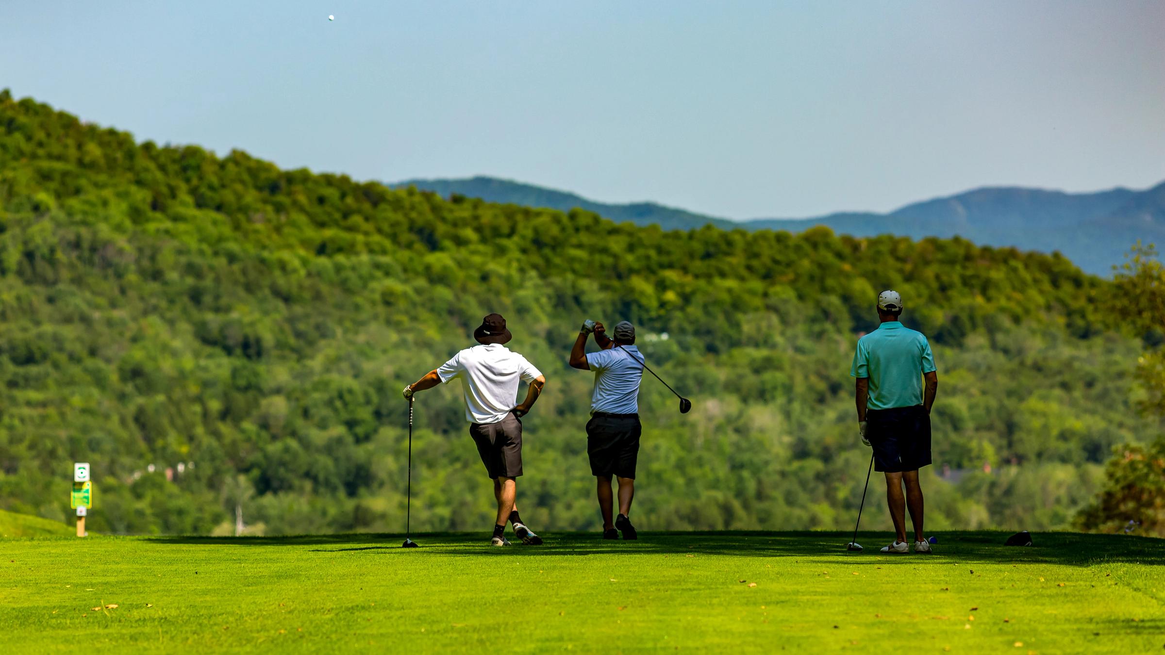 Group of friends teeing off