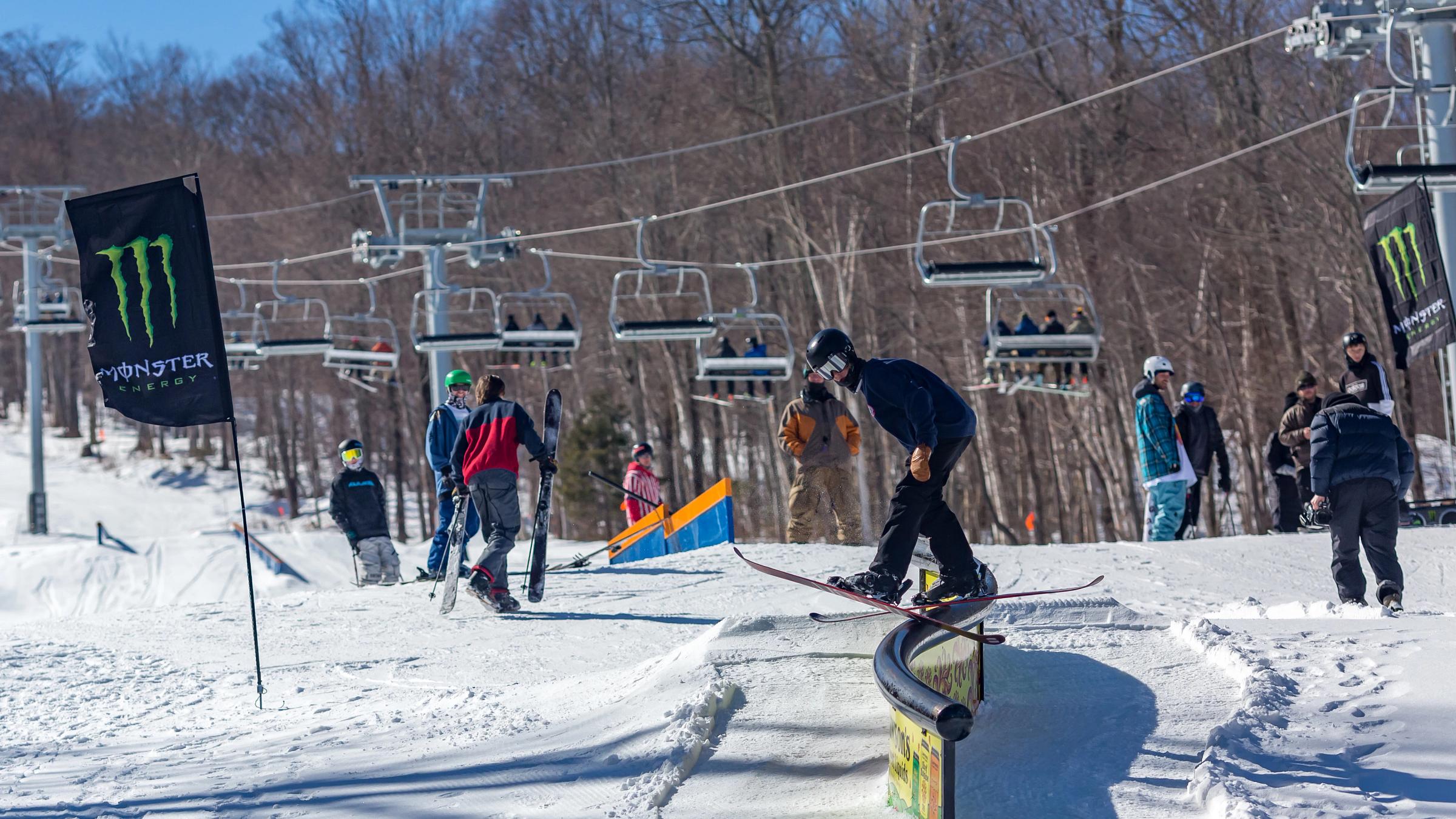 Skier on rail in park