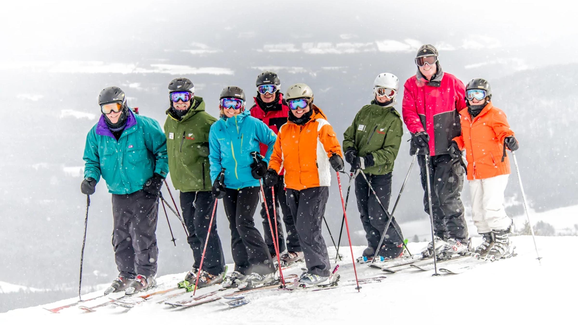 Group of skiers with Sugarbush employees