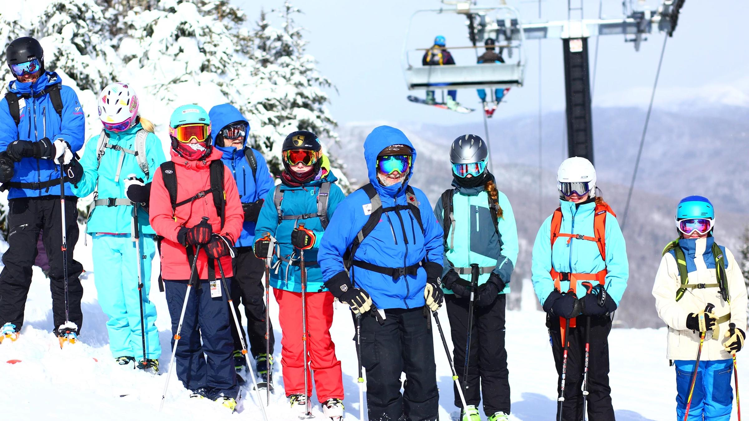 Ski coach with group of kids