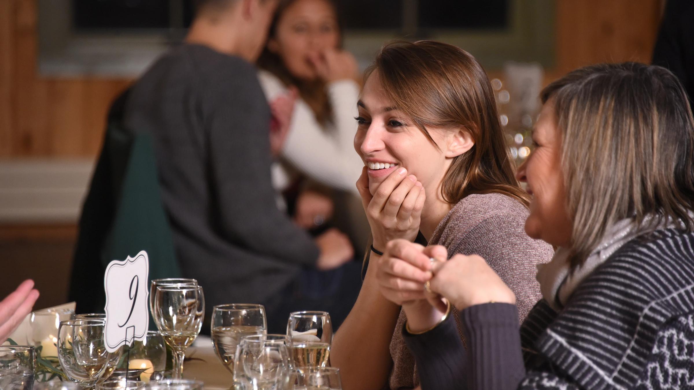 Two people smiling at a table in Gatehouse