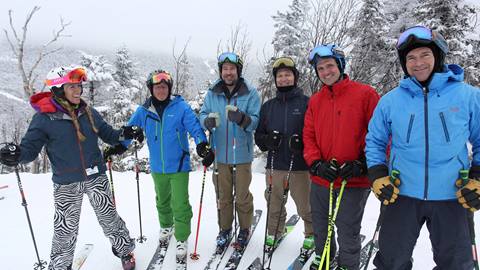 Group of smiling skiers