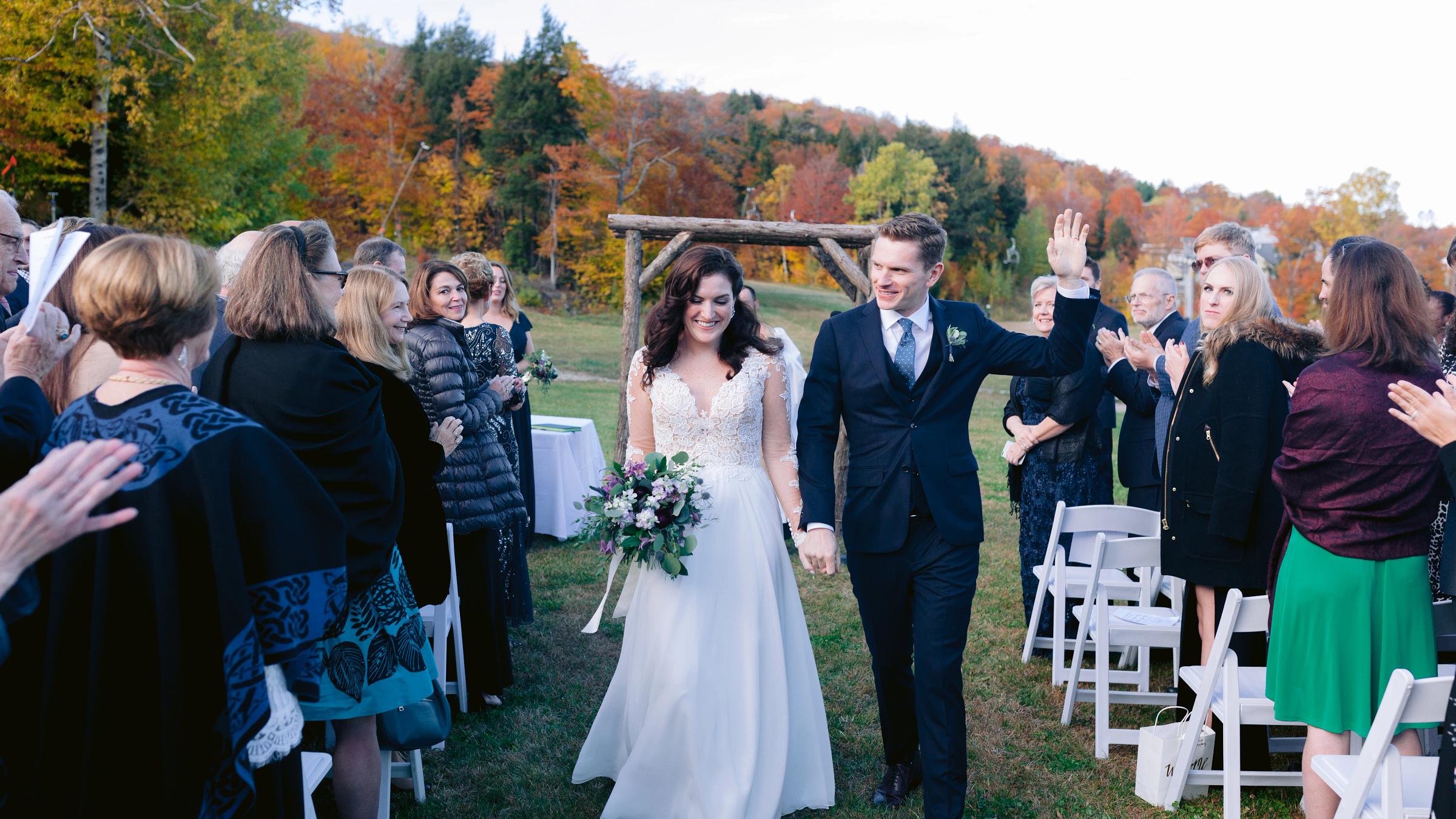 bride and groom walking down the aisle