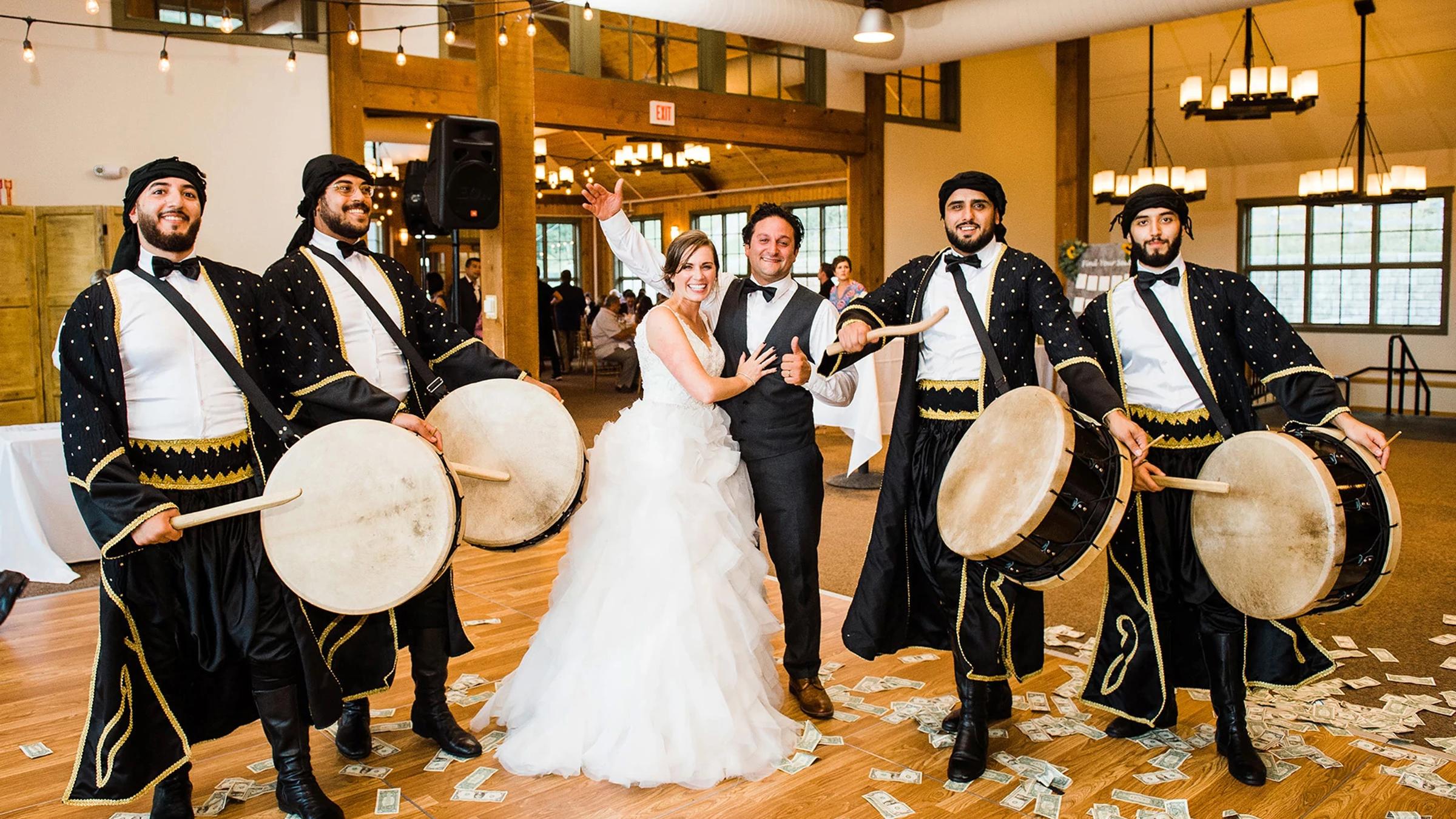 Bride and groom with band
