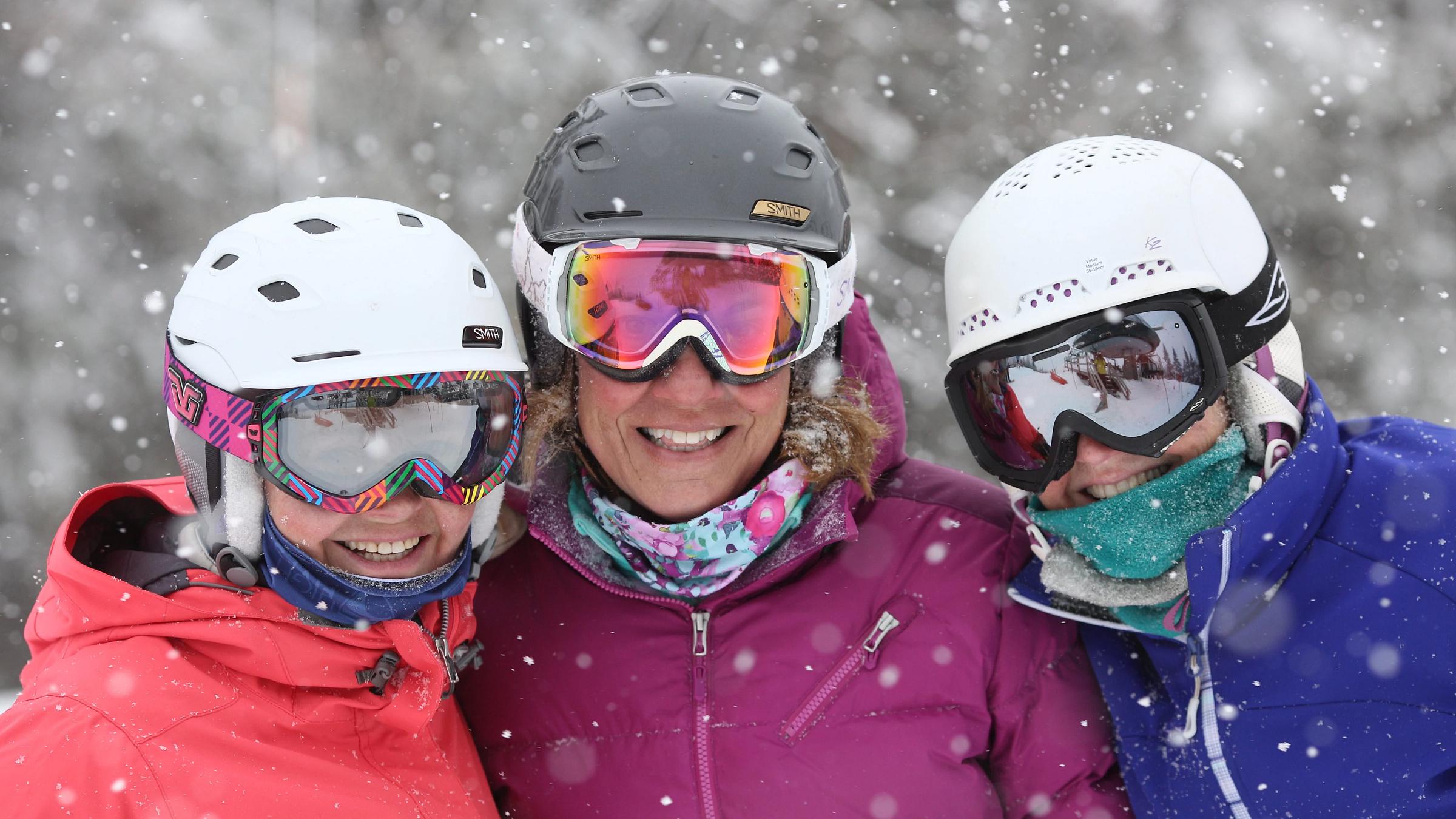 Three friends having fun in snow