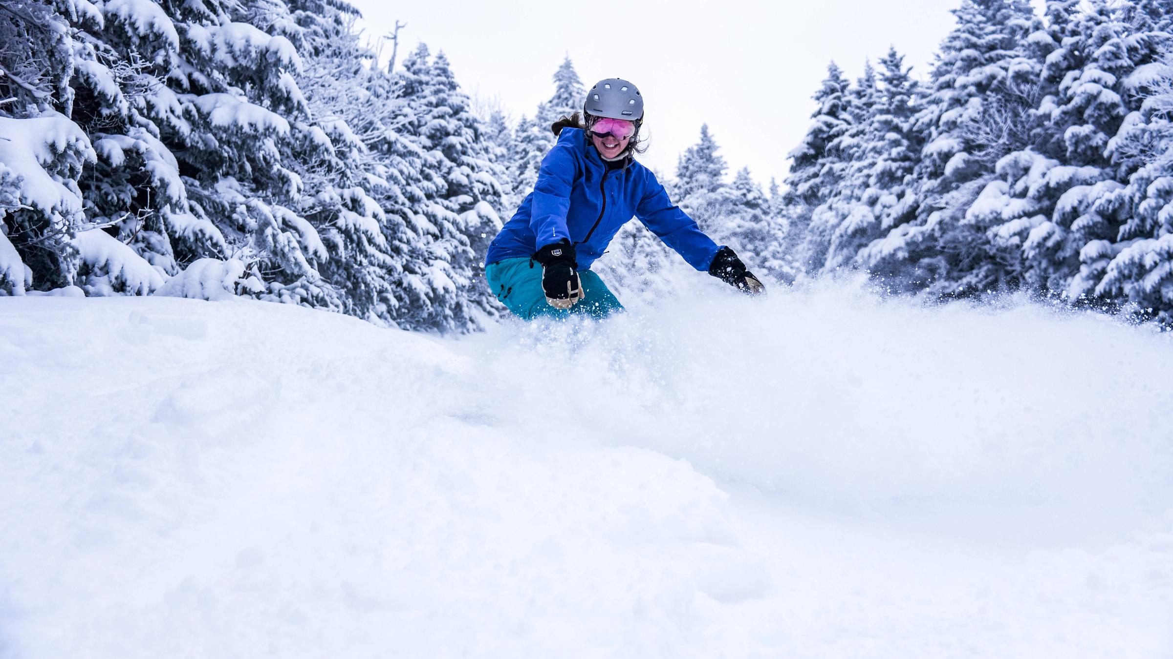 Female Snowboarder Powder